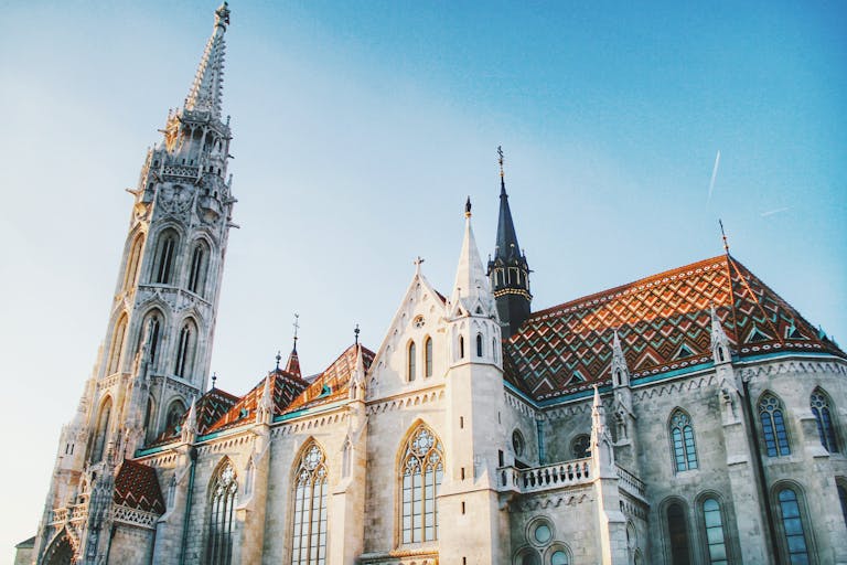 Beautiful Matthias Church with intricate architecture under a clear blue sky.